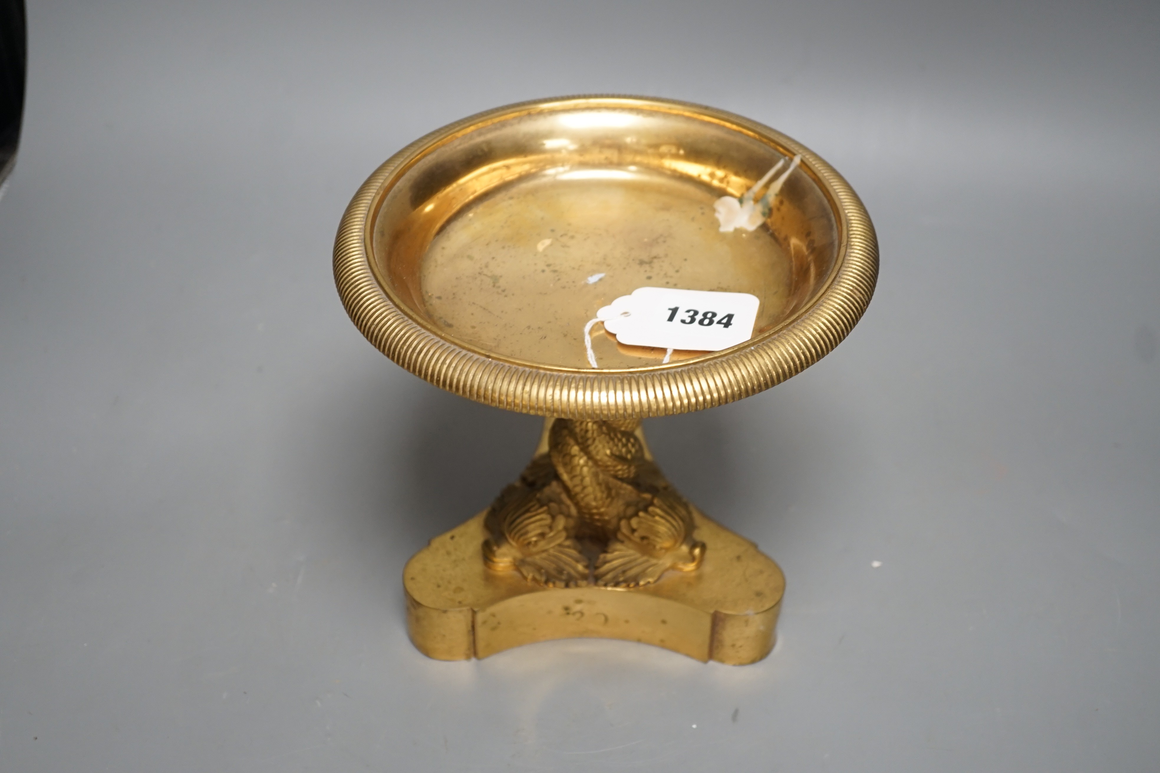 A Regency ormolu pedestal bowl, with dolphin stem, diameter 19cm, height 18cm.